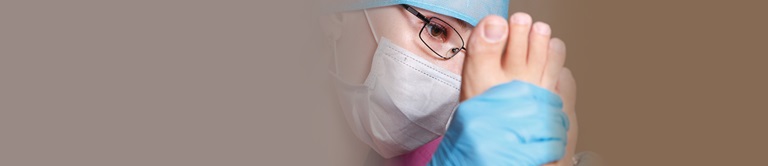 doctor examining the bottom of a patients foot
