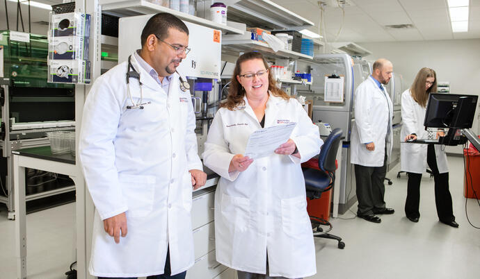 Medical professionals discussing results in lab