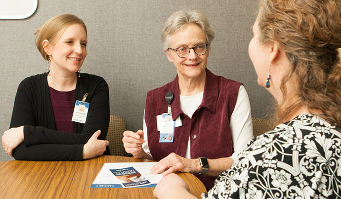 Three women talking.