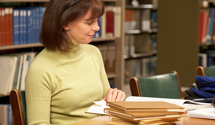 A woman reading in a library