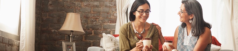 mom and daughter having coffee together