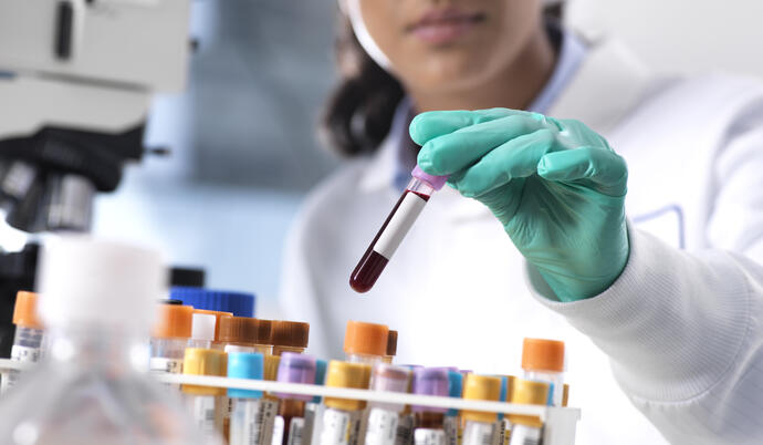 Lab worker with testing samples