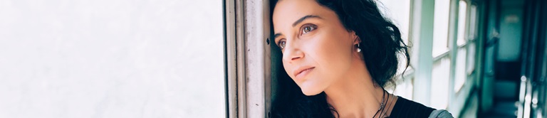 woman looking out a window