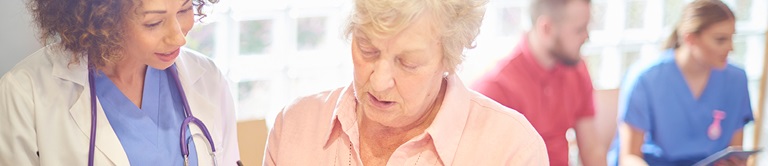 doctor talking with older patient
