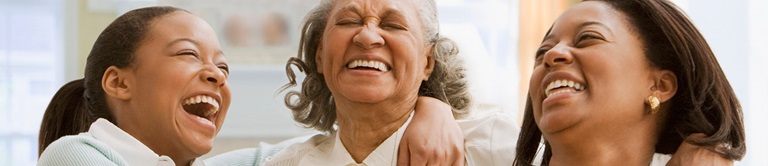 three woman laughing together