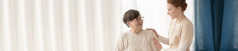 woman hands on elderly woman
