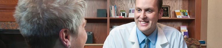 jonathan bleeker talking with a patient