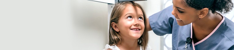 measuring the height of a little girl