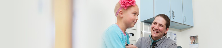 dr milanovich interacting with young girl