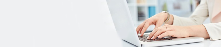 woman typing on a laptop
