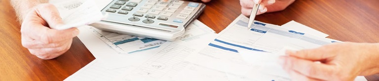 man and woman crunching numbers
