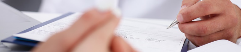 doctor filling out a form